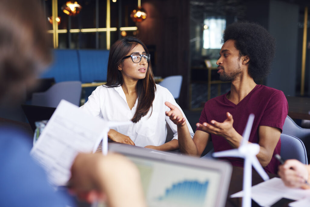 Two people having a conversation in a lead generation agency
