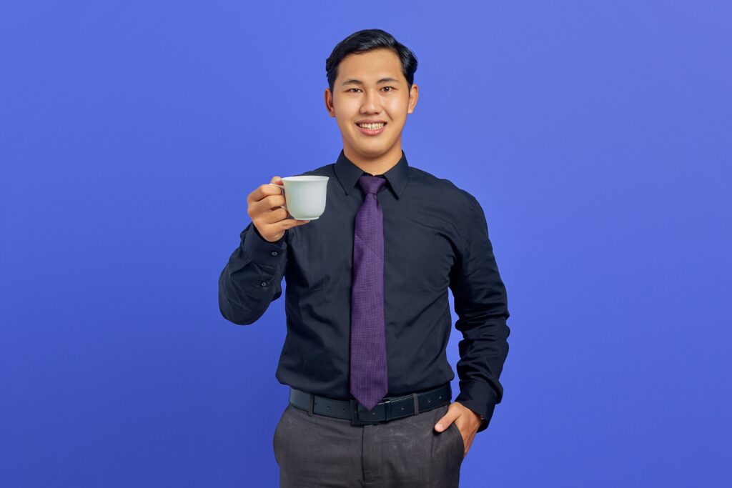 A direct marketing intern holding a cup